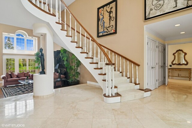 80 Gaelic Ct, Inverness, IL 60010 - stairs featuring a towering ceiling, crown molding, baseboards, and recessed lighting