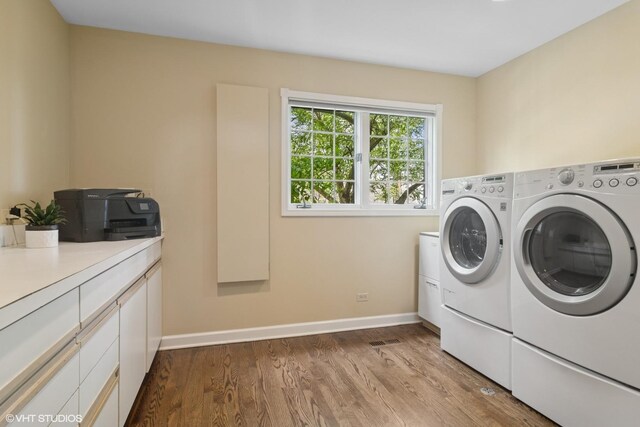 80 Gaelic Ct, Inverness, IL 60010 - laundry room featuring separate washer and dryer, dark wood-type flooring, baseboards, and cabinet space