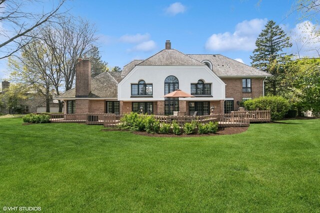 80 Gaelic Ct, Inverness, IL 60010 - back of house featuring a chimney, brick siding, and a wooden deck