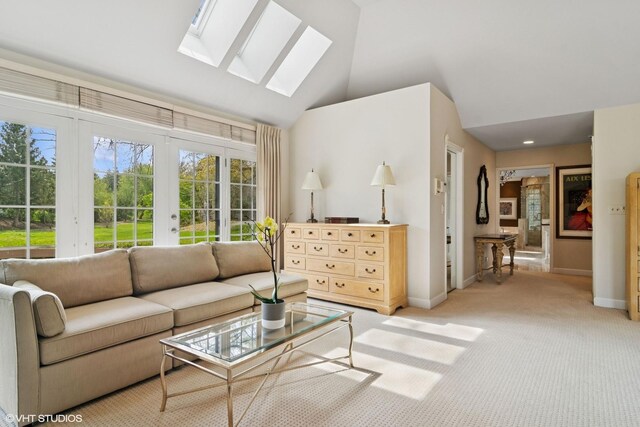 80 Gaelic Ct, Inverness, IL 60010 - living area featuring a skylight, baseboards, french doors, light carpet, and high vaulted ceiling