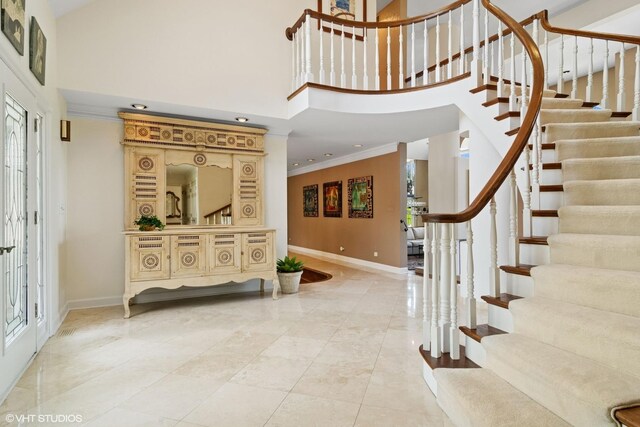 80 Gaelic Ct, Inverness, IL 60010 - foyer with baseboards, a high ceiling, stairs, ornamental molding, and light marble finish flooring
