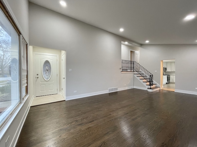 10724 Leclaire Ave, Oak Lawn, IL 60453 - entryway with recessed lighting, dark wood finished floors, healthy amount of natural light, stairs, and baseboards