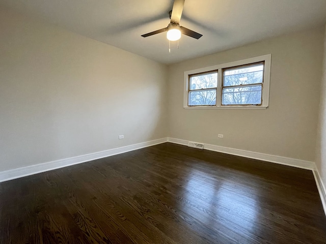 10724 Leclaire Ave, Oak Lawn, IL 60453 - spare room with baseboards, ceiling fan, and dark wood-type flooring