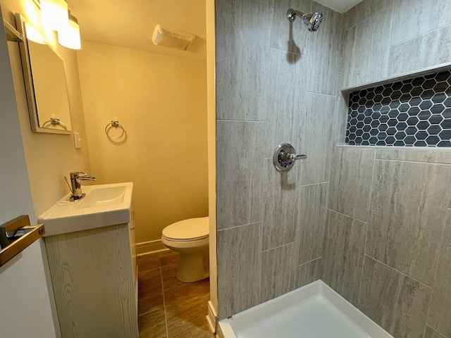 10724 Leclaire Ave, Oak Lawn, IL 60453 - bathroom featuring tiled shower, toilet, vanity, and wood finished floors