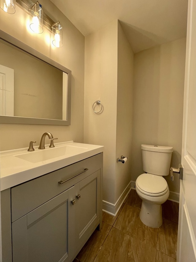10724 Leclaire Ave, Oak Lawn, IL 60453 - bathroom featuring toilet, baseboards, and vanity