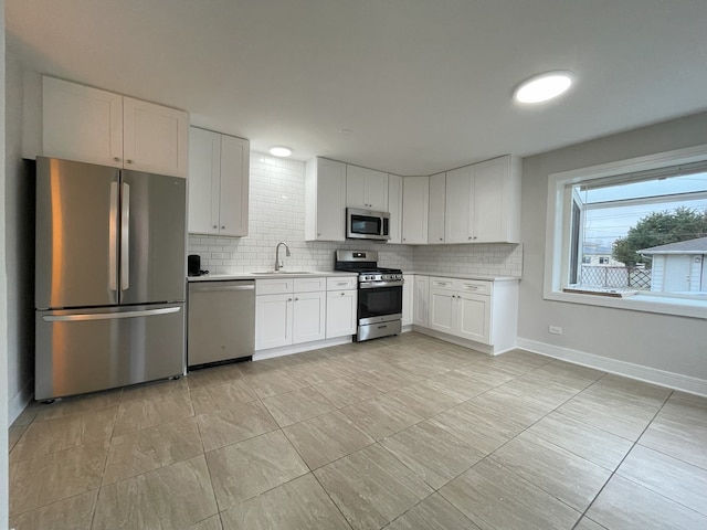 10724 Leclaire Ave, Oak Lawn, IL 60453 - kitchen with stainless steel appliances, a sink, light countertops, and backsplash