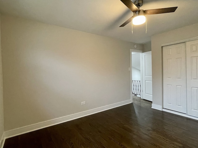 10724 Leclaire Ave, Oak Lawn, IL 60453 - unfurnished bedroom with baseboards, dark wood-type flooring, a closet, and a ceiling fan