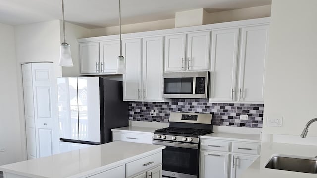 858 Finley Dr, Aurora, IL 60504 - kitchen with stainless steel appliances, a sink, tasteful backsplash, and light countertops