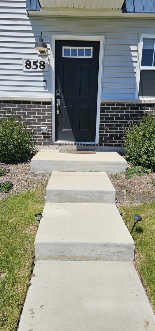 858 Finley Dr, Aurora, IL 60504 - entrance to property featuring brick siding