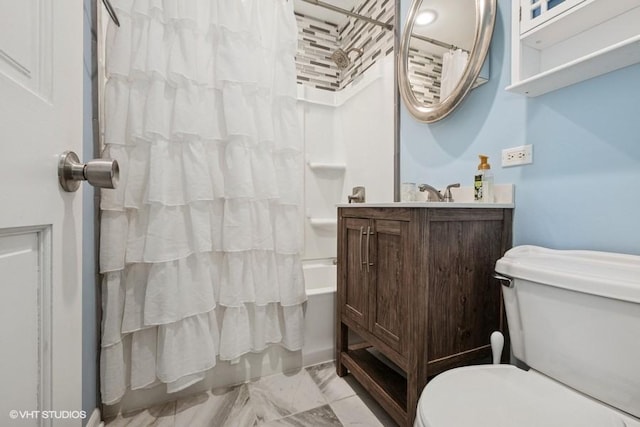 bathroom with marble look tiles, toilet, shower / bathtub combination with curtain, and vanity