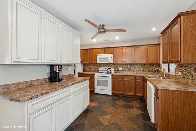 kitchen featuring white appliances, a sink, ceiling fan, decorative backsplash, and recessed lighting