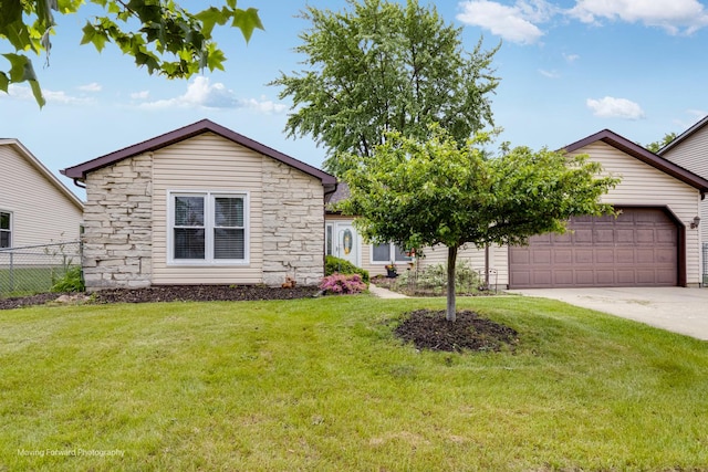 37 W Devon Ave, Glendale Heights, IL 60139 - view of front of house featuring stone siding, an attached garage, and driveway