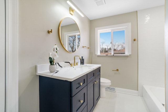 bathroom with toilet, vanity, baseboards, a bathtub, and a shower