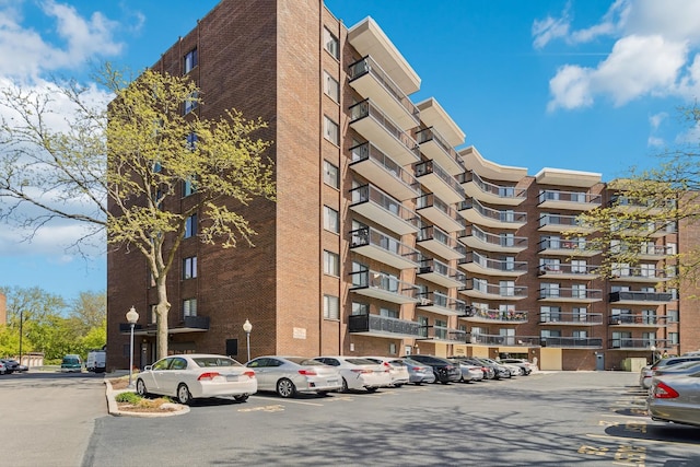 711 S River Rd Unit 503, Des Plaines, IL 60016 - view of apartment building / complex with uncovered parking