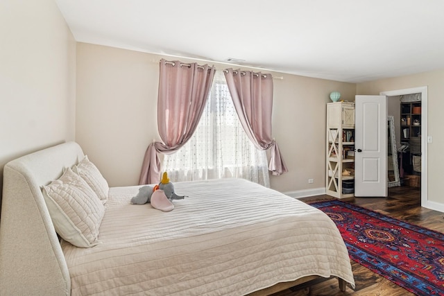 711 S River Rd Unit 503, Des Plaines, IL 60016 - bedroom featuring baseboards and wood finished floors