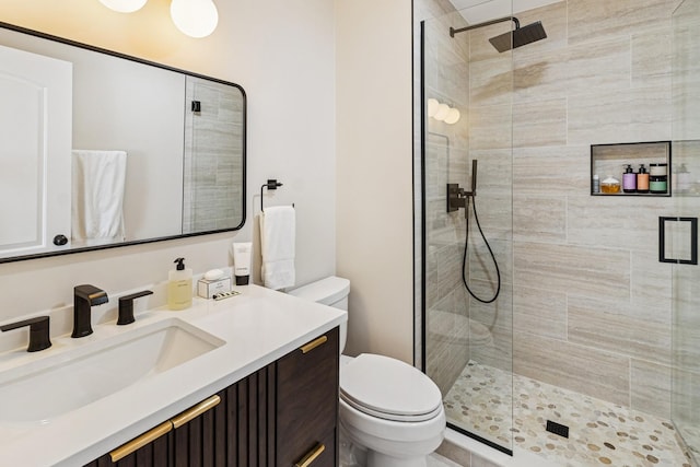 711 S River Rd Unit 503, Des Plaines, IL 60016 - bathroom featuring a stall shower, toilet, and vanity