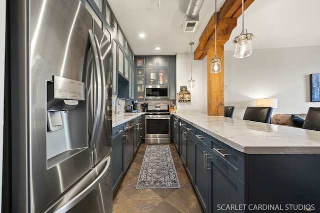1735 W Diversey Pkwy Unit 416, Chicago, IL 60614 - kitchen featuring appliances with stainless steel finishes, a peninsula, glass insert cabinets, a sink, and backsplash