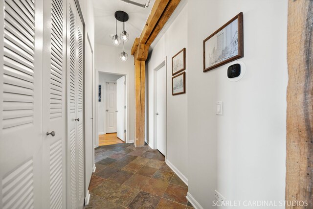 1735 W Diversey Pkwy Unit 416, Chicago, IL 60614 - hallway with stone tile floors and baseboards