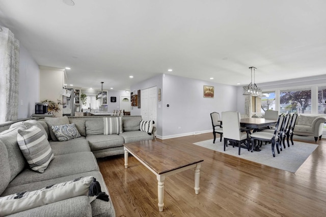 884 Arnold Ct, Des Plaines, IL 60016 - living area with wood finished floors, recessed lighting, and baseboards