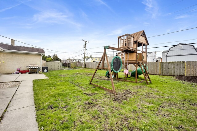 884 Arnold Ct, Des Plaines, IL 60016 - view of yard featuring a playground, a storage shed, and an outbuilding