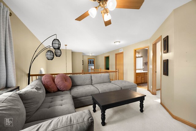 24001 W Walnut Cir, Plainfield, IL 60585 - living area with a ceiling fan, light carpet, and baseboards