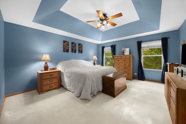 24001 W Walnut Cir, Plainfield, IL 60585 - bedroom with a tray ceiling, light colored carpet, baseboards, and ceiling fan