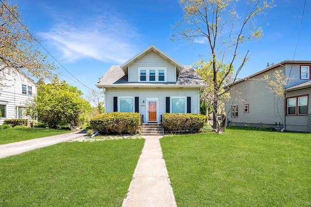 bungalow-style house featuring a front yard