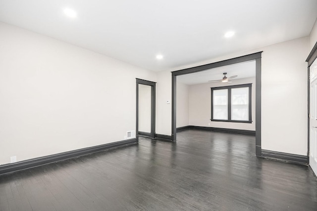 empty room featuring dark wood-type flooring, ceiling fan, baseboards, and recessed lighting