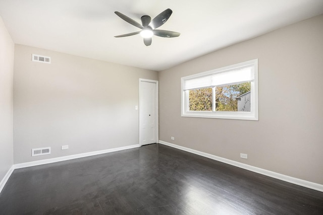 unfurnished room featuring a ceiling fan and baseboards