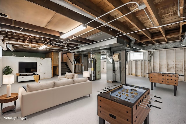 below grade area with gas water heater, stairs, and heating unit
