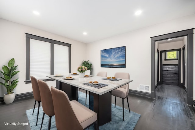 dining room featuring dark wood finished floors, baseboards, and recessed lighting