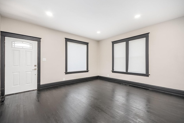 entrance foyer with dark wood finished floors, baseboards, and recessed lighting