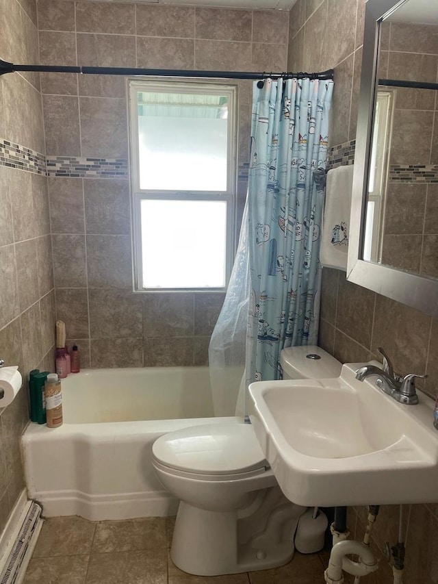 244 N 7th Ave, Kankakee, IL 60901 - bathroom featuring healthy amount of natural light, tile walls, toilet, shower / bath combination with curtain, and tile patterned flooring