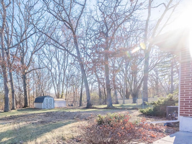 191 Juneway Ter, Lake Bluff, IL 60044 - view of yard with a storage shed, fence, an outbuilding, and cooling unit