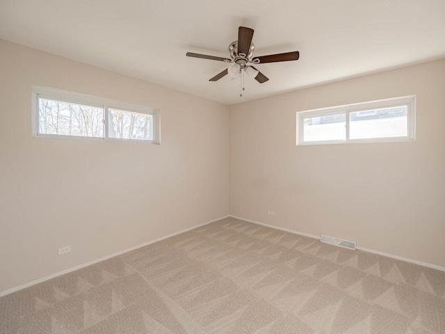 191 Juneway Ter, Lake Bluff, IL 60044 - empty room with plenty of natural light, light colored carpet, and baseboards