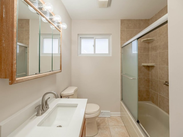 191 Juneway Ter, Lake Bluff, IL 60044 - bathroom featuring healthy amount of natural light, toilet, tile patterned flooring, and bath / shower combo with glass door