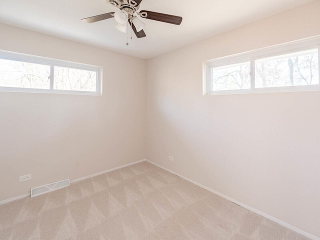 191 Juneway Ter, Lake Bluff, IL 60044 - spare room featuring light colored carpet, plenty of natural light, baseboards, and a ceiling fan