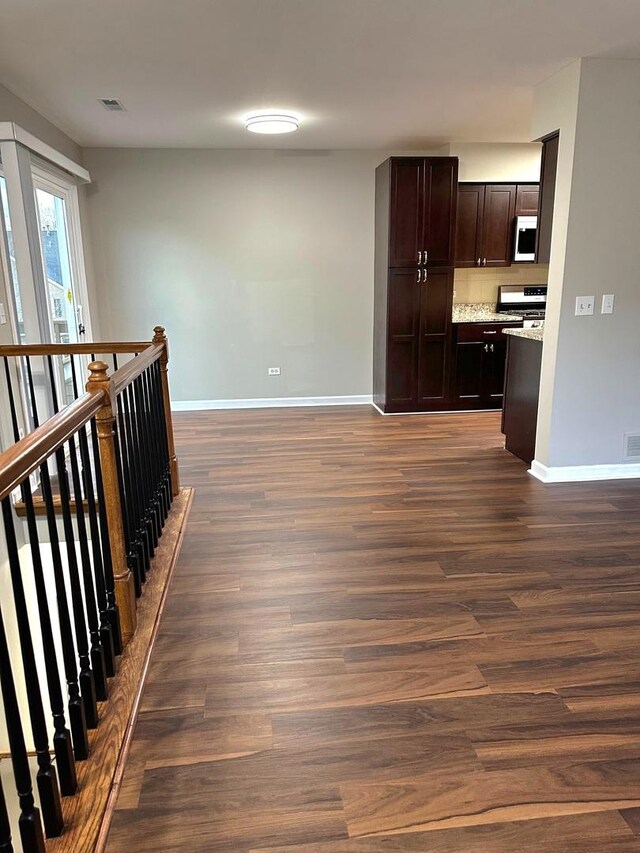 347 Village Creek Dr, Lake In The Hills, IL 60156 - corridor with dark wood finished floors and an upstairs landing