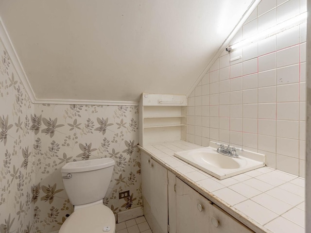 348 Behm Dr, Grayslake, IL 60030 - half bath featuring wallpapered walls, vaulted ceiling, toilet, and vanity