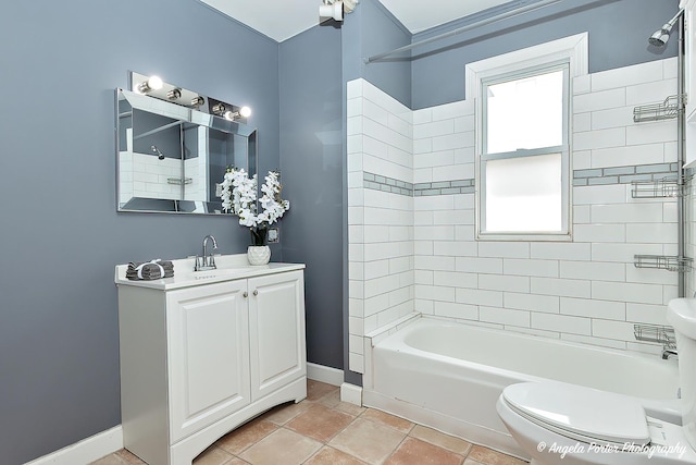 full bath featuring baseboards, bathtub / shower combination, vanity, and toilet