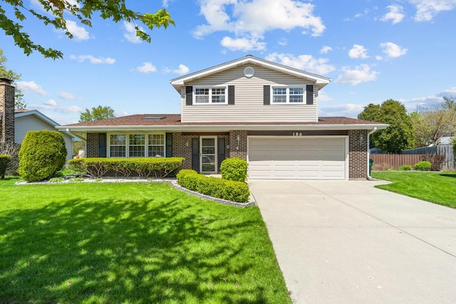186 Sunrise Dr, Wheeling, IL 60090 - traditional home with brick siding, driveway, and an attached garage