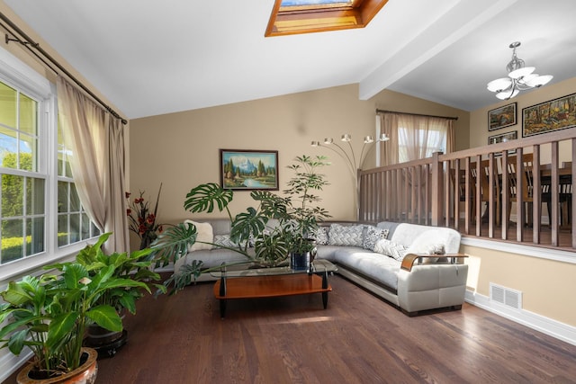 186 Sunrise Dr, Wheeling, IL 60090 - living area with a skylight, wood finished floors, a chandelier, and baseboards
