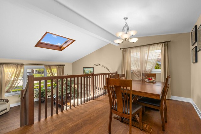 186 Sunrise Dr, Wheeling, IL 60090 - dining space featuring wood finished floors, a chandelier, a skylight, and baseboards