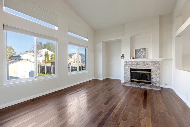 900 Taralon Trl, Lake In The Hills, IL 60156 - unfurnished living room featuring dark wood-style floors, high vaulted ceiling, a brick fireplace, and baseboards