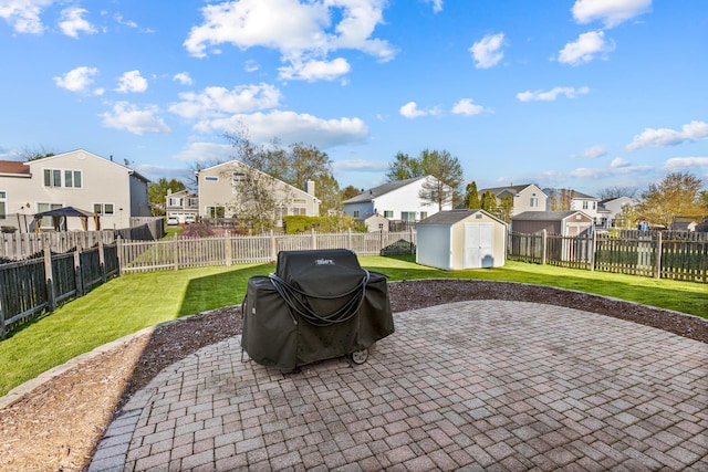 900 Taralon Trl, Lake In The Hills, IL 60156 - view of patio with a residential view, a storage shed, a grill, and an outbuilding