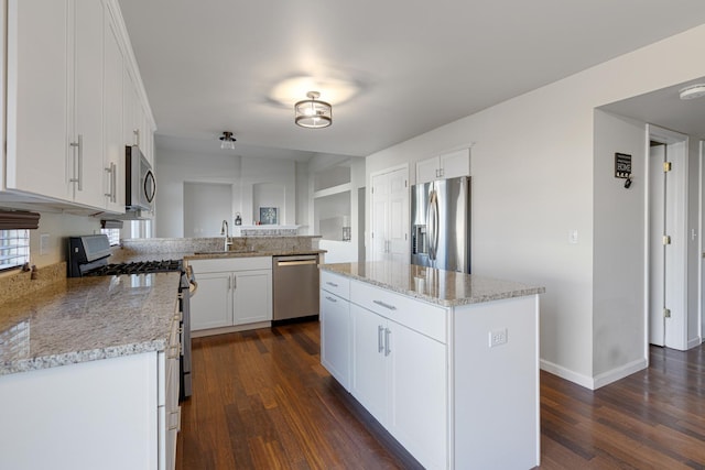 900 Taralon Trl, Lake In The Hills, IL 60156 - kitchen featuring appliances with stainless steel finishes, a sink, dark wood-style floors, white cabinets, and light stone counters