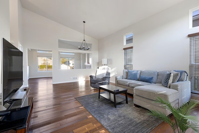 900 Taralon Trl, Lake In The Hills, IL 60156 - living area with high vaulted ceiling, dark wood finished floors, a chandelier, and baseboards