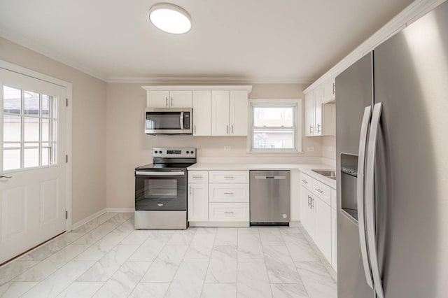 640 Enterprise Rd, Chicago Heights, IL 60411 - kitchen featuring appliances with stainless steel finishes, light marble finish flooring, light countertops, and ornamental molding