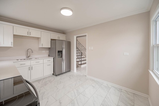 640 Enterprise Rd, Chicago Heights, IL 60411 - kitchen featuring stainless steel fridge with ice dispenser, a sink, light countertops, white cabinets, and crown molding