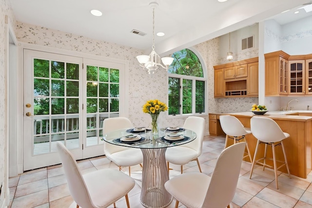 12811 S 82nd Ct, Palos Park, IL 60464 - dining space with wallpapered walls, a chandelier, light tile patterned floors, and recessed lighting